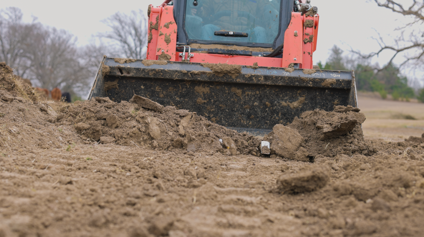 Bulldozer pushing dirt in a construction site.